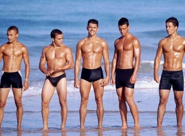 men on the beach with enlarged cocks
